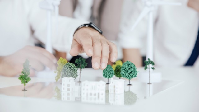 Small model trees and houses on a table
